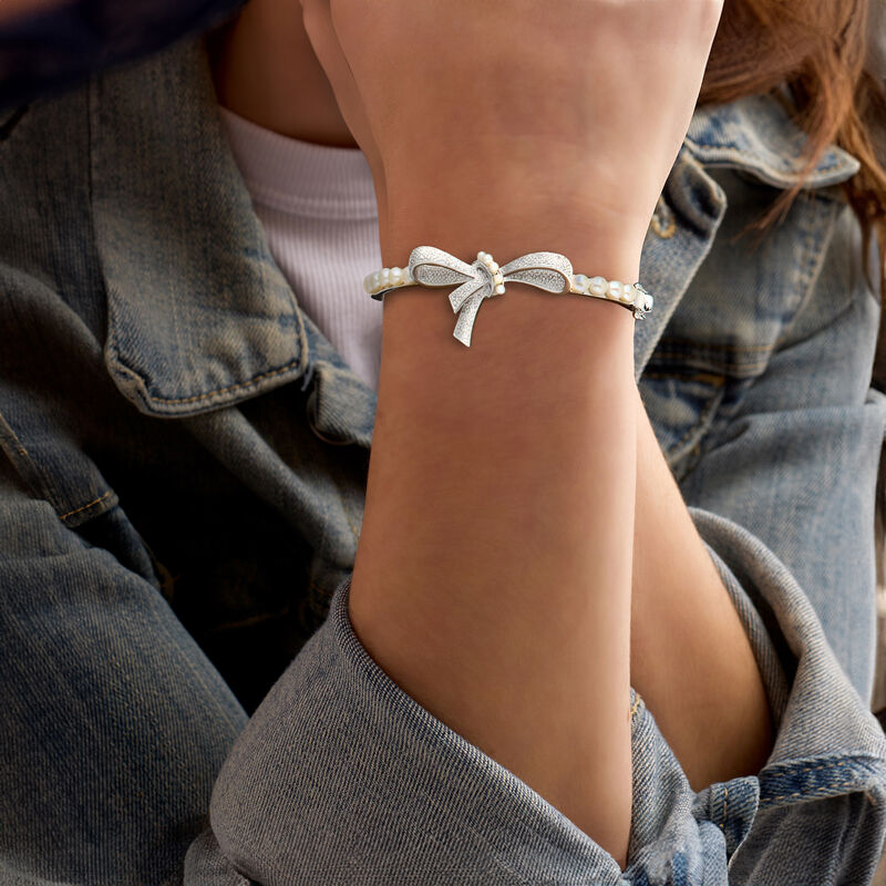 2-4.5mm Cultured Pearl and .11 ct. t.w. Diamond Bow Bangle Bracelet in Sterling Silver image number 1