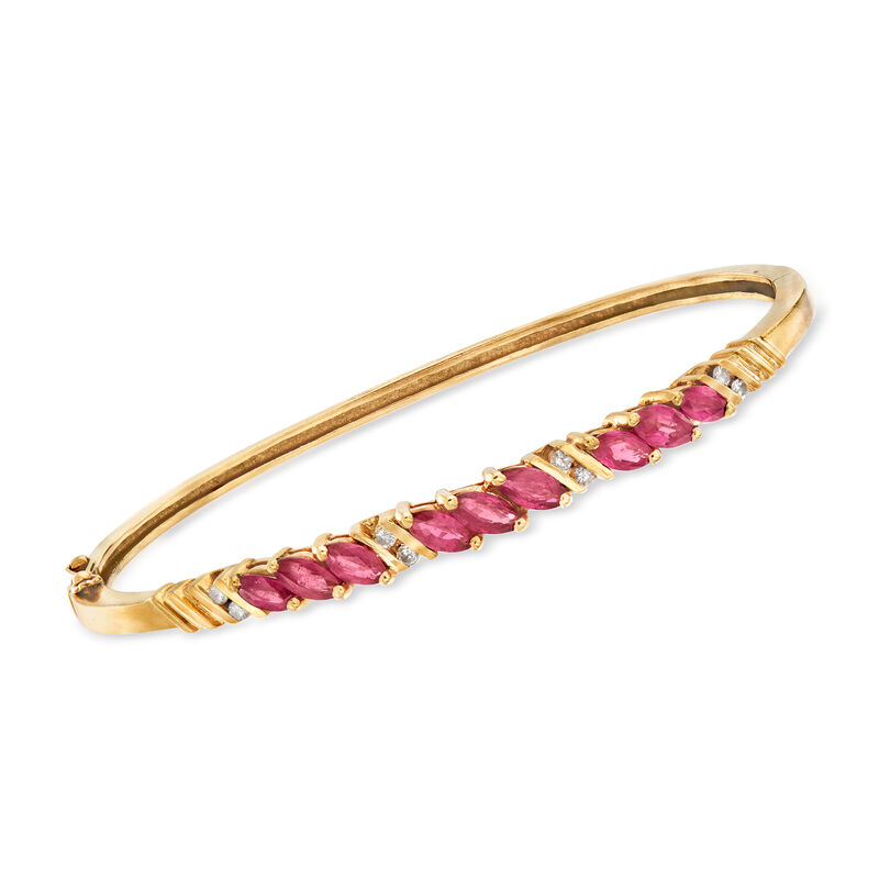 C. 1980 Vintage 2.70 ct. t.w. Ruby and .20 ct. t.w. Diamond Bangle Bracelet in 14kt Yellow Gold image number 0