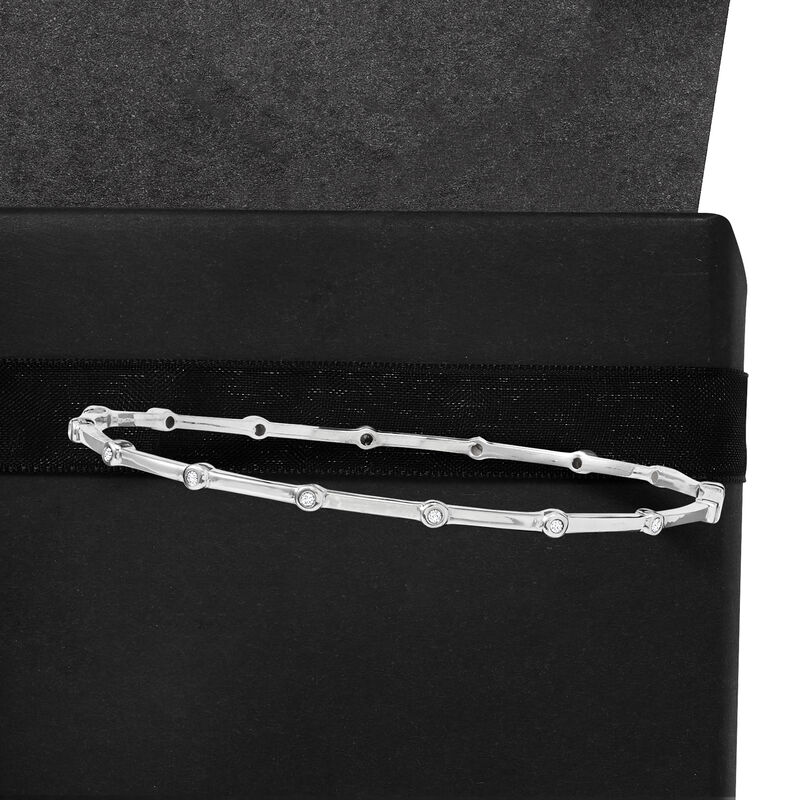 .25 ct. t.w. Diamond Bezel Bangle Bracelet in Sterling Silver image number 1