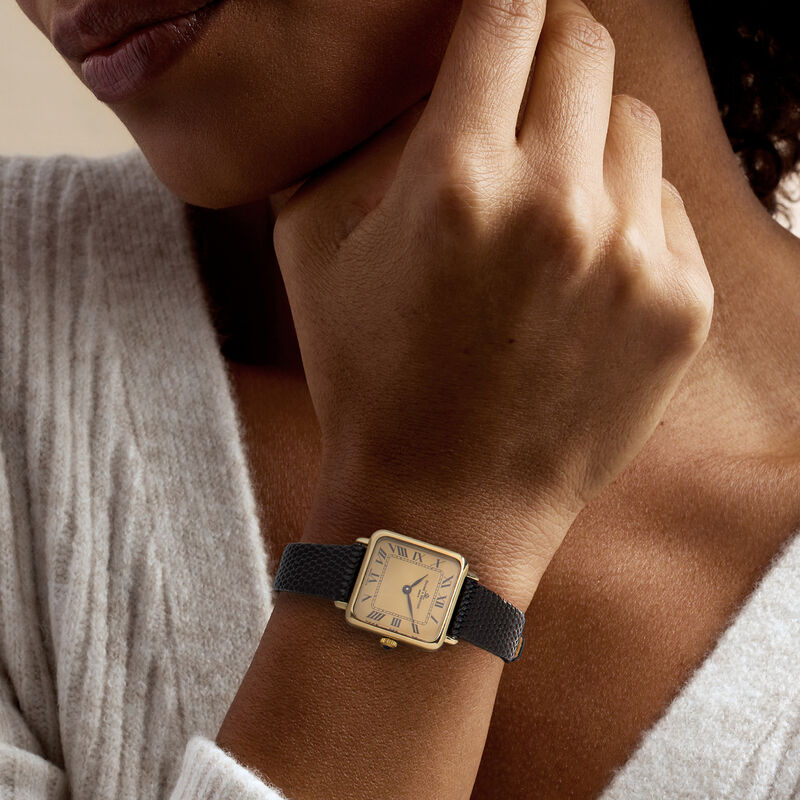 C. 1980 Vintage Baume et Mercier Women's 23mm 14kt Yellow Gold Watch with Black Leather Strap. 7" image number 1