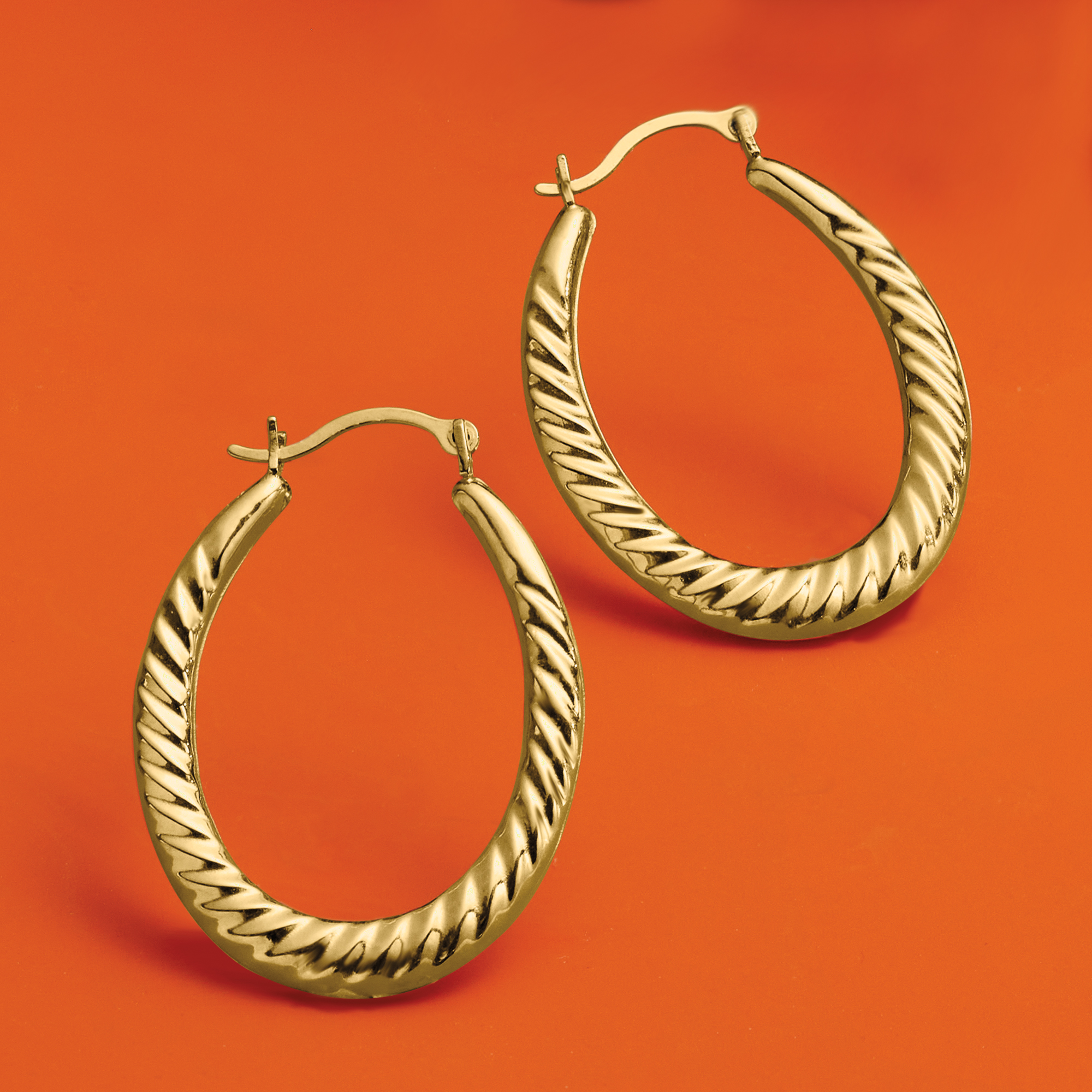 Twisted oval hoop earrings discount